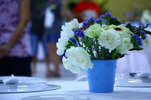 Sky blue floral container to match the color motif for 65th wedding anniversary