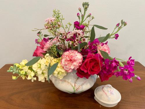 Part of the tea pots project, this one took on the wild side by using wax flower, and stocks to add width to the arrangement.