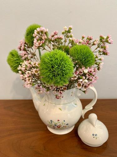 Part of the tea pots project, the combination of pink wax flower and green dianthus created a miniature image of lush trees and blooming cherry blossoms.