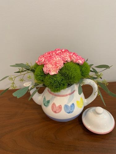 Is that a peony? Part of the tea pots project, we created a peony look-a-like by bunching together stems of carnations.