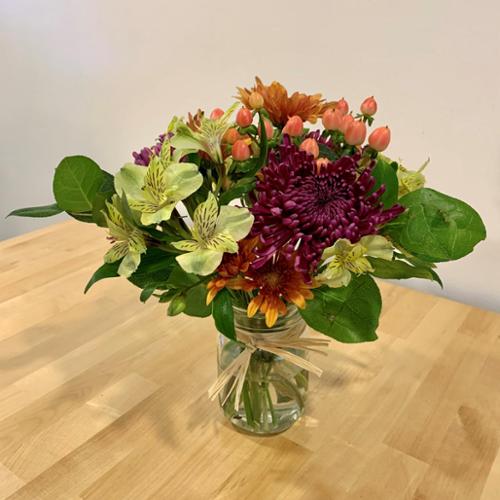 A small arrangement of some of the "star flowers of fall." This rustic-style bouquet is a perfect gift for the thanksgiving host. Gift packaging available upon request.